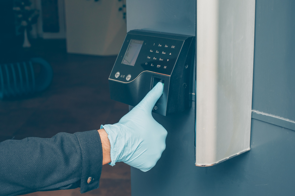 man-getting-intercom-read-his-fingerprint-open-door-with-gloves freshly paved-parking-lot small