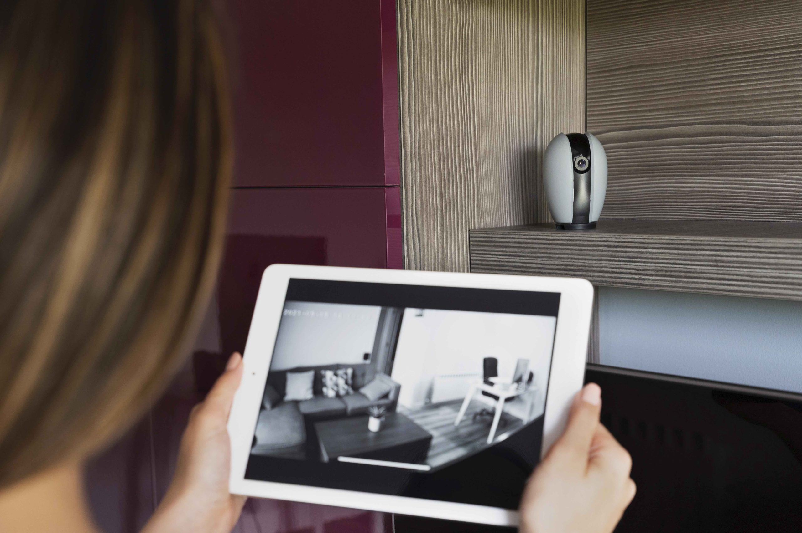 close-up-woman-checking-security-camera